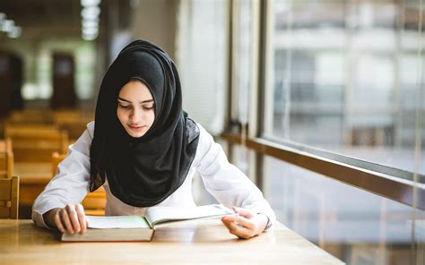 Muslim Girl Student Studying At The Library