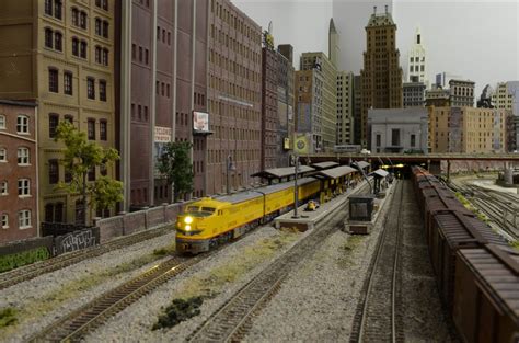 Union Pacific Passenger Train At Station With Freight Lumbering By
