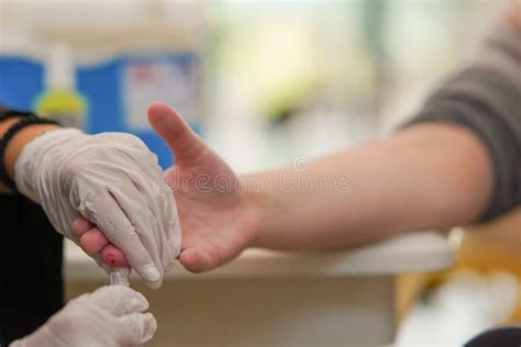 Nurse Taking A Blood Sample Out Of The Patients Finger Stock Image