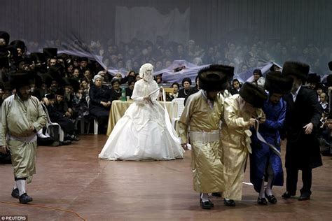 Our studio knows where and when we should be to catch that special moment and the moments to come. Ultra Orthodox Jewish bride is led by a ribbon to her ...