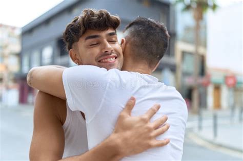 Two Hispanic Men Couple Smiling Confident Hugging Each Other At Street Stock Image Image Of