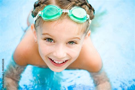 Little Girl In Swimming Pool Stock Photo Adobe Stock