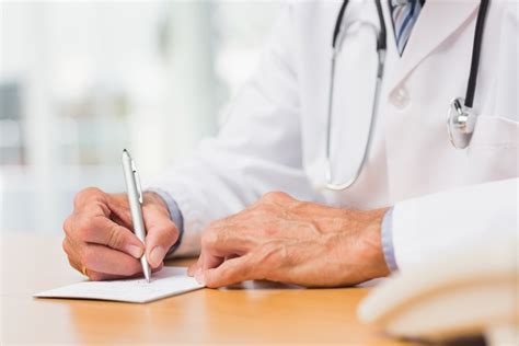 Doctor Writing Prescription Clearbrook Treatment Centers