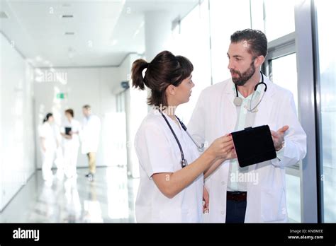 Doctors And Nurses Talking In Corridor Hospital Spain Stock Photo Alamy