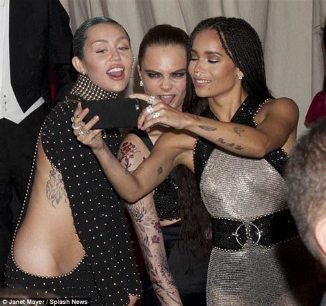 rebels miley cyrus cara delevingne and zoe kravitz break the selfie ban metgala daily mail