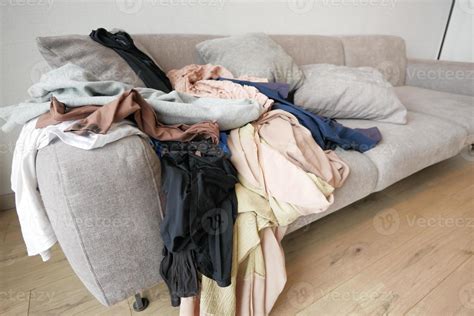 Messy Clothes On Sofa At Home 20826528 Stock Photo At Vecteezy