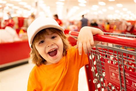 Toddler Boy With Shopping Bag In Supermarket Stock Photo Image Of
