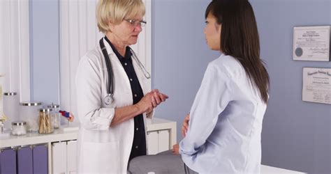 Doctor Asking Patient Questions In Her Office Stock Footage Video