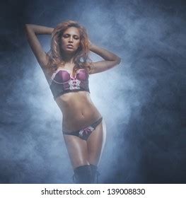 Beautiful Sexy Striptease Dancer Over Smoky Stock Photo