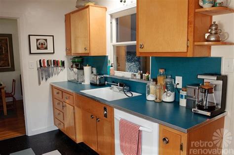 Though the pink pastel cabinets and vintage stove are retro enough, the black and white checker flooring in this kitchen from kissmyaster really seals the deal. Sarah's "super economical" retro kitchen remodel featuring ...