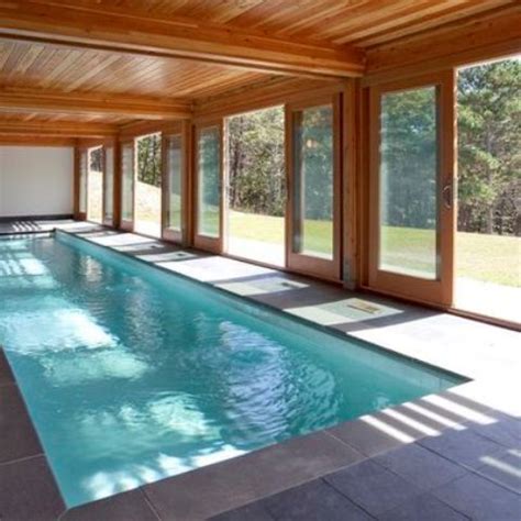 Amazing gallery of interior design and decorating ideas of enclosed lap pool in living rooms, decks/patios, pools by elite interior designers. 30 Indoor Swimming Pools That Will Make You Envy - DigsDigs