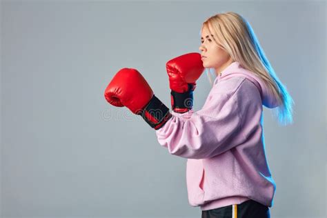 Female Boxer In Red Boxing Gloves Making Punch At A Boxing Studio