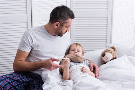 Father Taking Care Of Sick Son In Free Stock Photo And Image