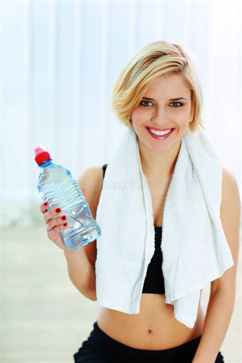 Cheerful Fit Woman Holding A Bottle With Water Stock Photo Image Of