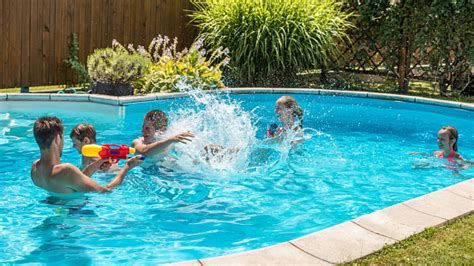 People Having Fun In Swimming Pool Stock Photo Download Image Now