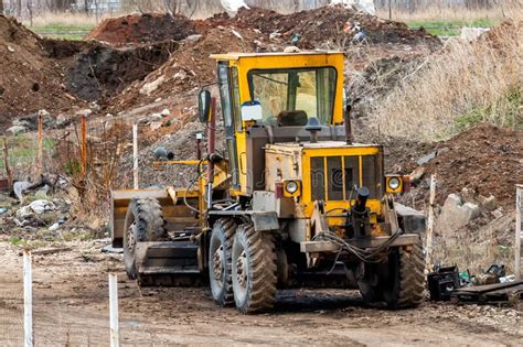 Yellow Grader In A Landfill Stock Photo Image Of Graders