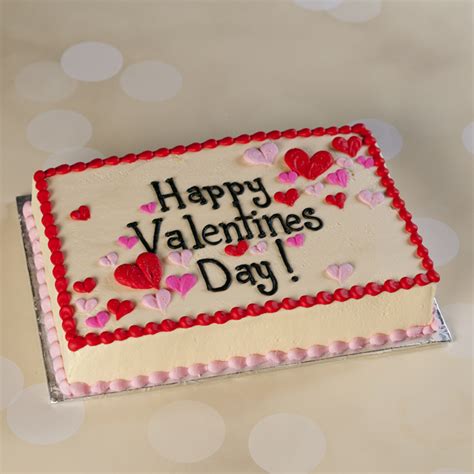 Valentines day party table with showstopper hearts cake with lens flare. Valentine's Day Cakes