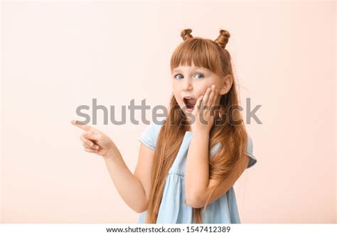 Surprised Little Girl Pointing Something On Stock Photo 1547412389