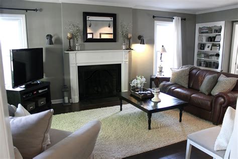 A Living Room Filled With Furniture And A Fire Place In The Corner On