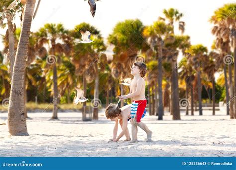 Two Little Kids Boys Having Fun On Tropical Beach Happy Best Friends