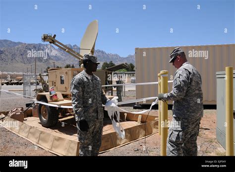Soldiers From The 86th Engineer Support Battalion Set Up The Satellite