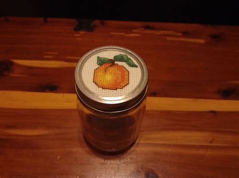 Maybe you would like to learn more about one of these? Cross Stitched mason jar lid | Mason jar lids, Mason jars, Jar