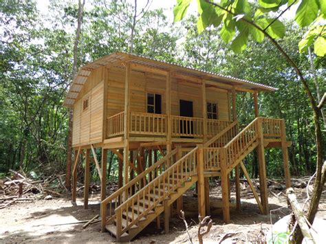 It's a slope house plan, using stilts to level the cabin and even though the designers took a bare bones approach they still managed to create a few wow moments on the inside, especially with the double tread, open riser staircase that leads from the main level to the second storey. 11 Best Stilt Cabin Plans - Home Plans & Blueprints