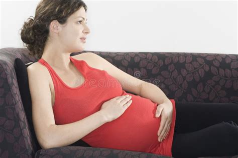 Thoughtful Pregnant Woman Relaxing On Sofa Stock Image Image Of Female Beautiful 33895489