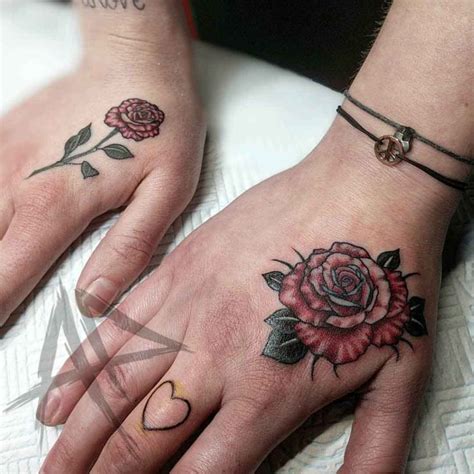 The design is colored with heavy black ink, so this tattoo is easy to notice from far away. Rose Hand Tattoo | Best Tattoo Ideas Gallery