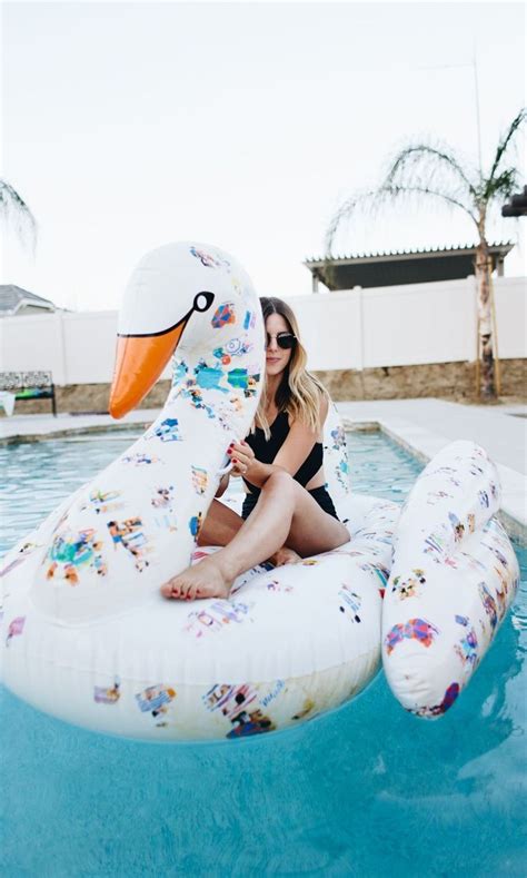 the one thing every fashion girl needs this weekend swan pool float pool floaties cute pool