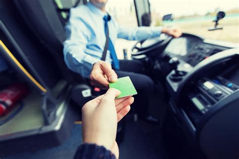 Bus Driver Taking Ticket Or Card From Passenger Pp5dktq Airport