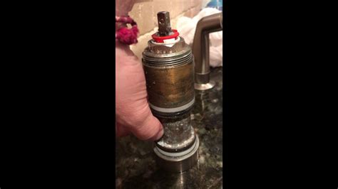 Identify the area that is leaking. Kohler Faucet leaking at base - YouTube