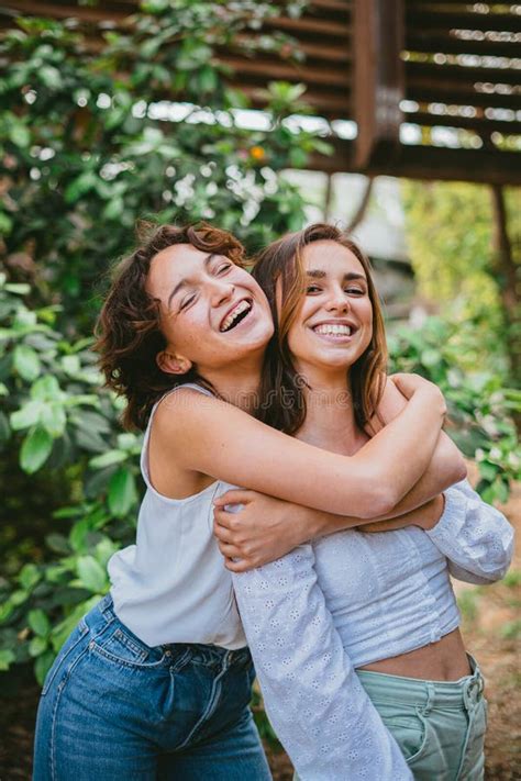 Two Teenage Girls Hugging And Laughing Stock Photo Image Of Woman