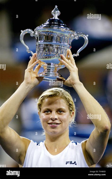 Kim Clijsters Of Belgium Holds Her Us Open Championship Trophy After