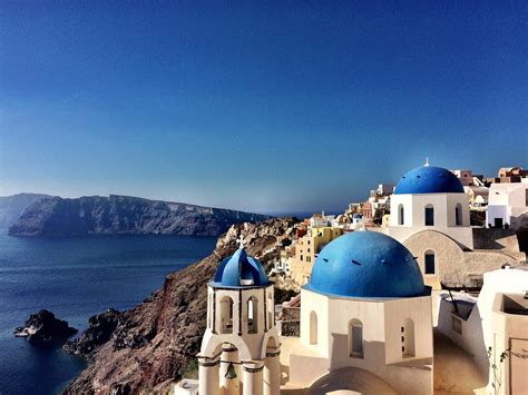 Blue And White Cliff Homes Of Oia Greece