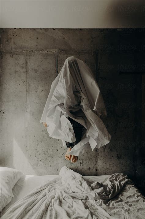 Ghost Like Figure Of A Woman Wearing A Bed Sheet Over Her Head While