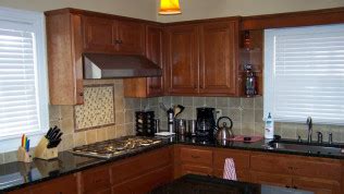 Cabinet refacing is essentially a replacement of the cabinet skins—removing the doors and drawer fronts and applying a new veneer over the existing surface of the body (carcass) of the cabinets. Custom Cabinets | Cabinet Refacing | San Antonio, TX