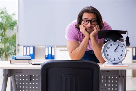 Young Male Student In Time Management Concept Stock Photo Image Of