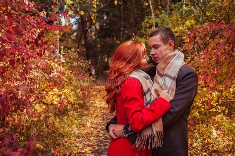 Young Couple Hugs In Autumn Forest Among Stock Image Image Of Laugh