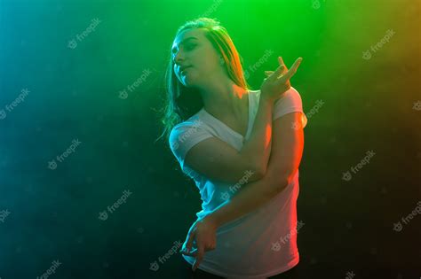 premium photo dance sport and people concept cheerleading girl dancing on multicolored