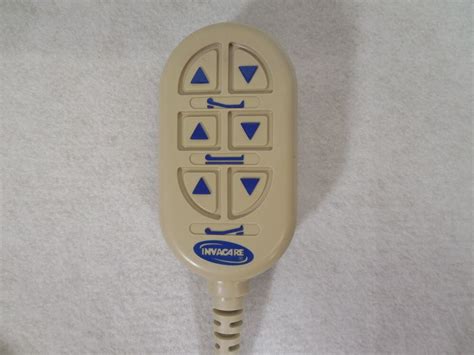 The hand control remote with hook at the back. Invacare Full-electric Hospital Bed Remote Hand Control ...