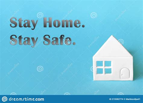 Stay Home Stay Safe Photo With A House On A Blue Background Stock