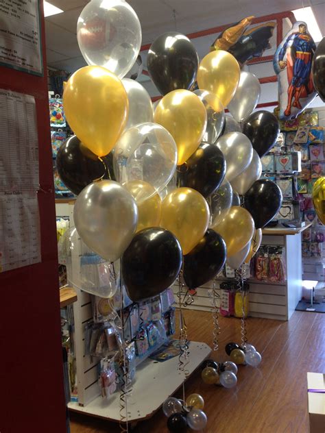 Maybe you would like to learn more about one of these? 9 balloon floor arrangements in gold, black, silver and ...