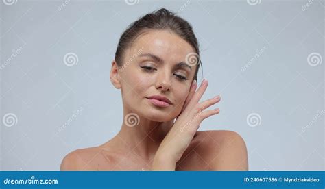 Beauty Portrait Of Good Looking Woman Who Softly Touches Her Chin With