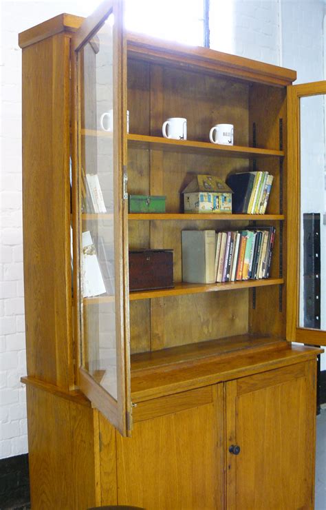 The truth is, they serve almost the same purposes with most people not being in a position to differentiate what is stored where. Vintage English Oak School Half Glazed Cabinet Cupboard