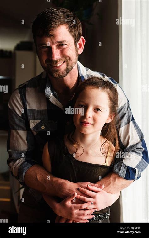 Portrait Of A Happy Father Hugging His Daughter Stock Photo Alamy