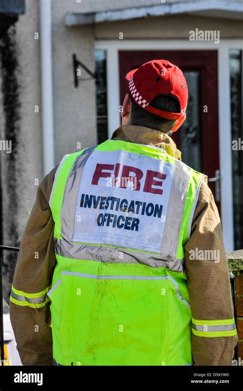 A Fire Investigation Officer Examines A Fatal House Fire Stock Photo
