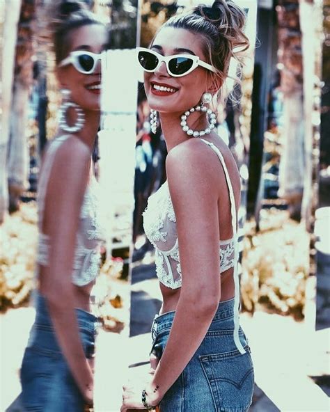 Hailey Baldwin Wears Saint Laurent Sunglasses And Levi S Shorts At Coachella Hailey Baldwin