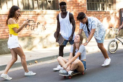 Group Of Active Teenagers Making Recreational Activity In An Urban Area