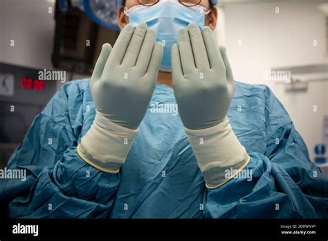 Scrub Nurse In Operating Room Getting Ready For A Neurosurgical
